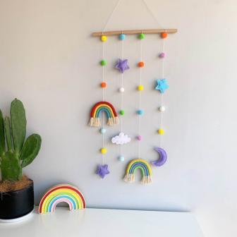 hanging display with colorful rainbows, paired with moon, star and felt balls